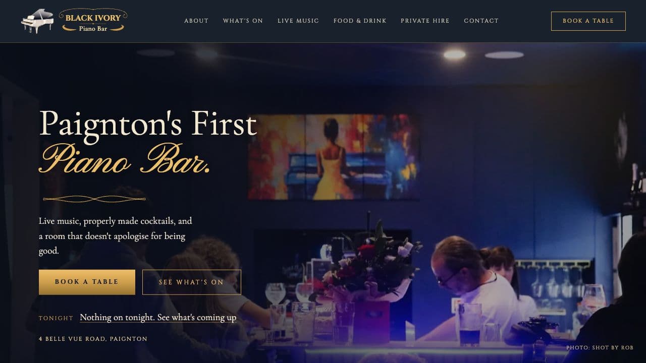 Black Ivory restaurant website, with a dark design and food photography